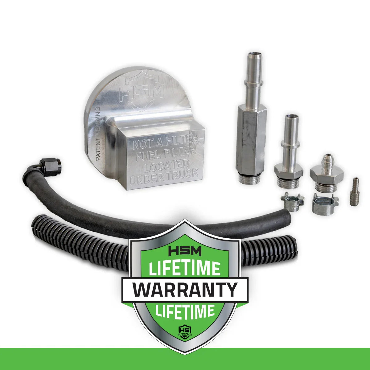 2011–2016 Ford 6.7L Power Stroke Upper Fuel Filter Bypass Kit with lifetime warranty badge, featuring billet block, fittings, hose, and protective sleeve.