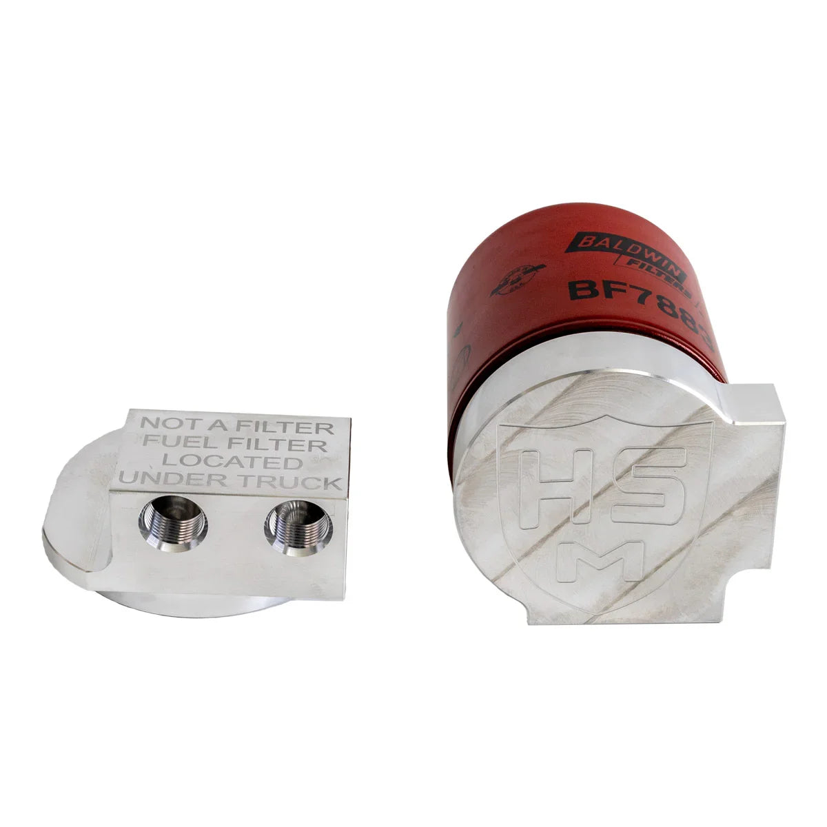 Close-up view of H&S Motorsports fuel filter relocation block and Baldwin BF7883 filter assembly for 2011–2016 Ford 6.7L Power Stroke.