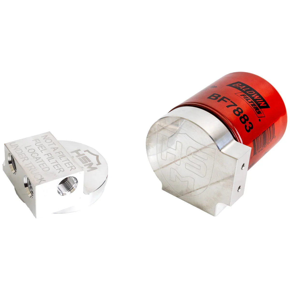 Angled view of billet blocks from the H&S Motorsports fuel filter relocation kit for 2017–2023 Ford 6.7L Power Stroke, with Baldwin BF7883 filter installed.