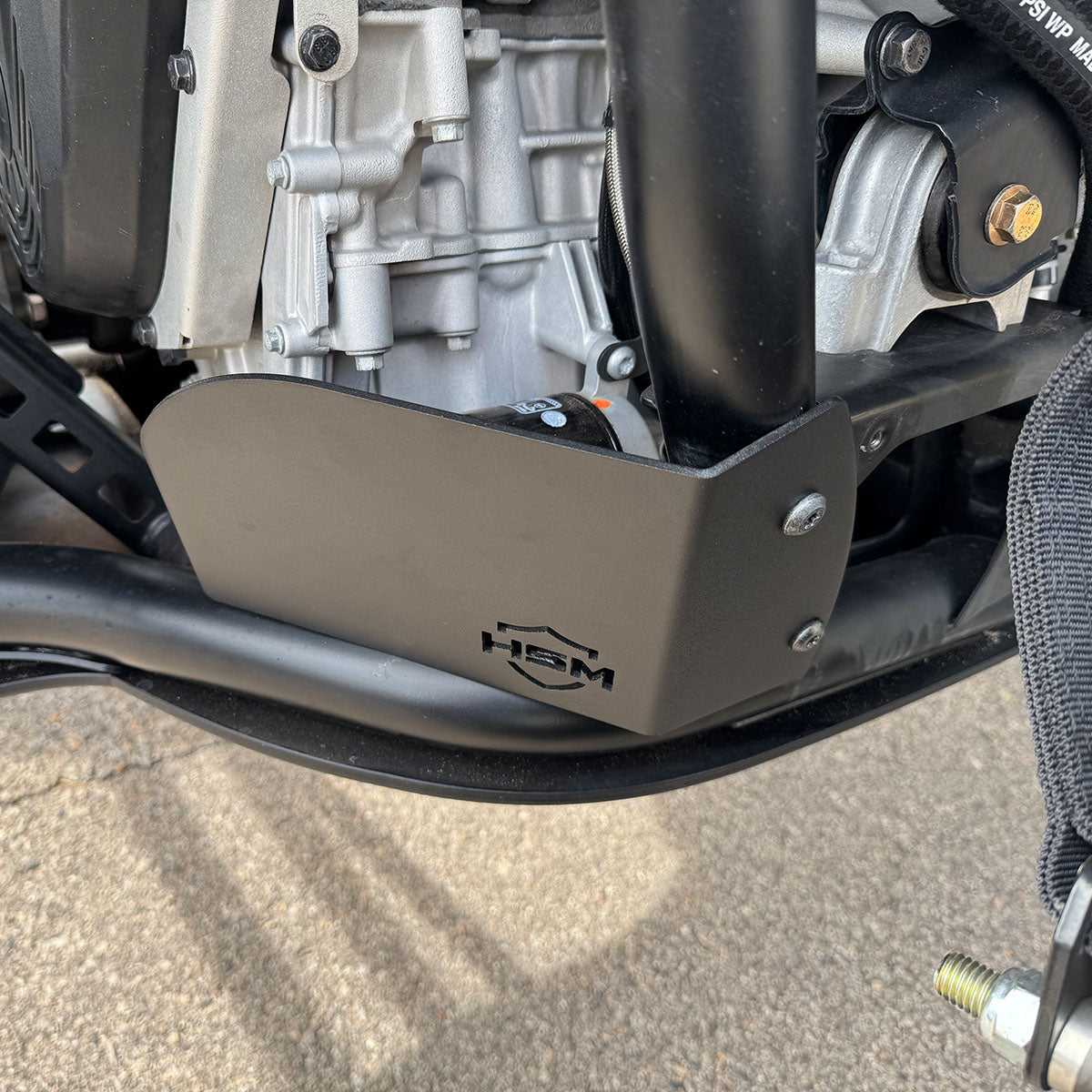 
                  
                    Installed HSM oil filter guard protecting the underside of Polaris RZR PRO R engine.
                  
                