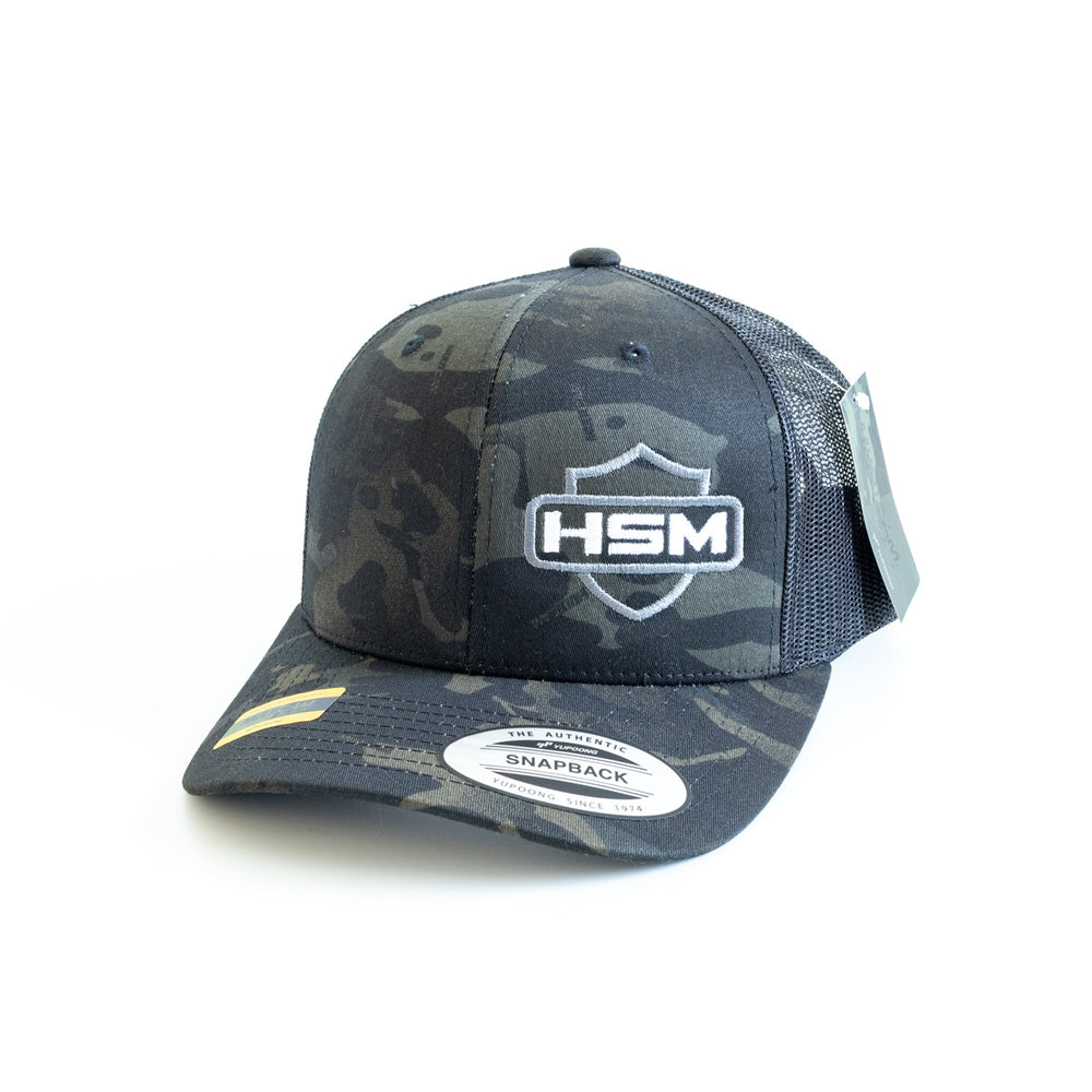 
                  
                    HSM Shield Logo Snapback – Black Camo
                  
                